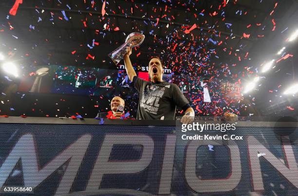 Tom Brady of the New England Patriots raises the Vince Lombardi Trophy after defeating the Atlanta Falcons during Super Bowl 51 at NRG Stadium on...