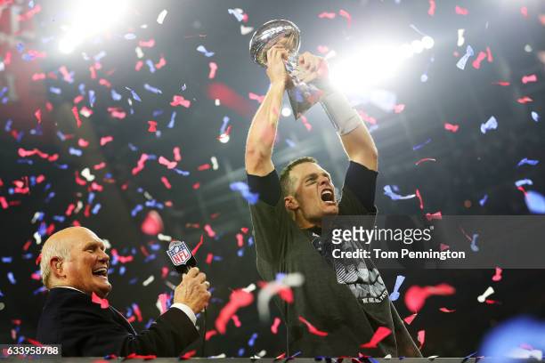 Tom Brady of the New England Patriots holds the Vince Lombardi Trophy after defeating the Atlanta Falcons 34-28 in overtime during Super Bowl 51 at...