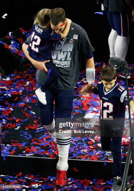 Tom Brady of the New England Patriots celebrates with his kids after defeating the Atlanta Falcons 34-28 in overtime during Super Bowl 51 at NRG...