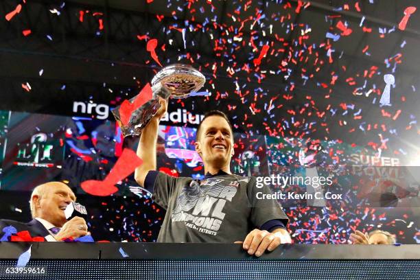Tom Brady of the New England Patriots celebrates with the Vince Lombardi Trophy after defeating the Atlanta Falcons during Super Bowl 51 at NRG...