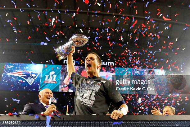 Tom Brady of the New England Patriots celebrates with the Vince Lombardi Trophy after defeating the Atlanta Falcons during Super Bowl 51 at NRG...