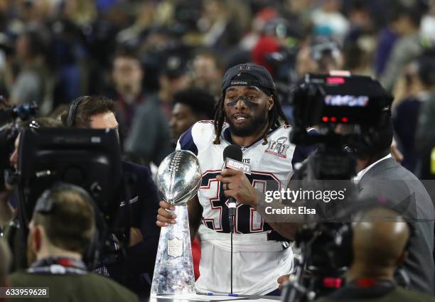 Brandon Bolden of the New England Patriots celebrates with the Vince Lombardi trophy after the Patriots defeat the Atlanta Falcons 34-28 during Super...