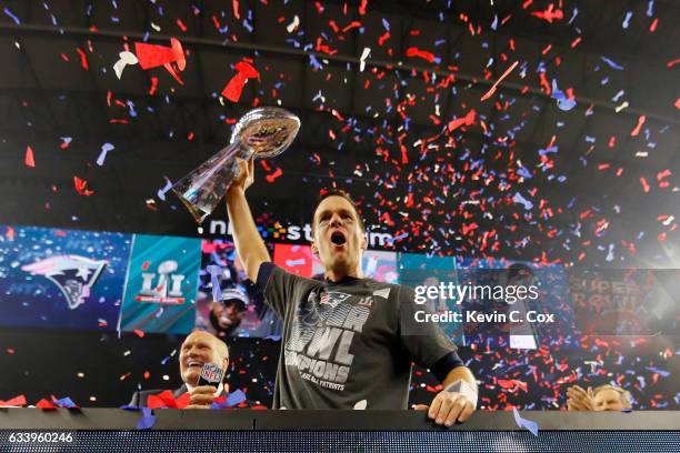 Tom Brady of the New England Patriots celebrates with the Vince Lombardi Trophy after defeating the Atlanta Falcons during Super Bowl 51 at NRG...