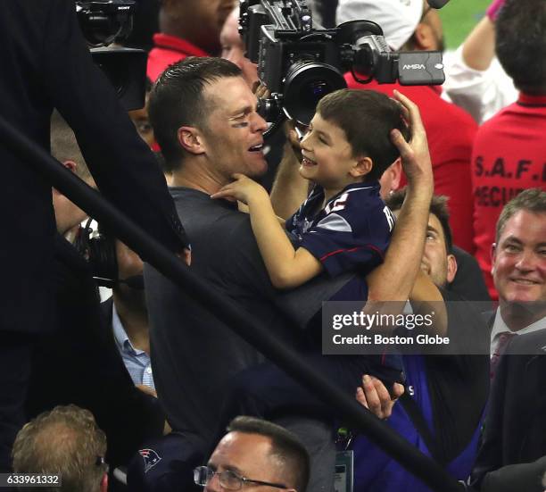 New England Patriots quarterback Tom Brady celebrates winning Super Bowl LI with his son. The Patriots defeated the Atlanta Falcons in overtime at...