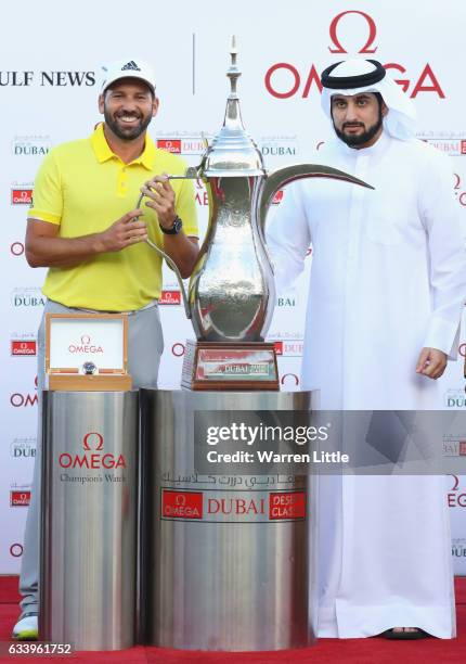 Sergio Garcia of Spain is presented with the trophy by His Highness Shaikh Ahmed Bin Mohammed Bin Rashid Al Maktoum the President of the UAE National...