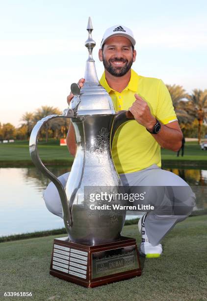 Sergio Garcia of Spain poses with the trophy after winning the final round of the Omega Dubai Desert Classic on the Majlis course at Emirates Golf...