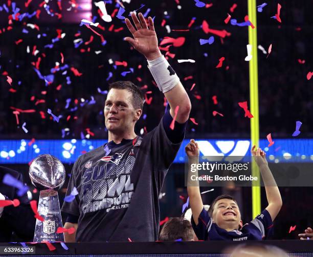 New England Patriots quarterback Tom Brady and his son celebrate after the Patriots defeated the Atlanta Falcons in Super Bowl LI at NRG Stadium in...