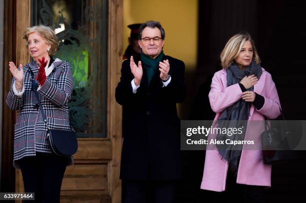 Former Education Minister Irene Rigau, former Catalan President Artur Mas and former Vice-president Joana Ortega applaud to the crowd as they arrive...