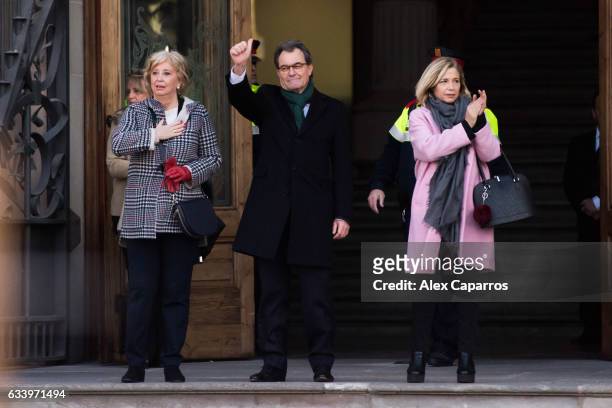 Former Education Minister Irene Rigau, former Catalan President Artur Mas and former Vice-president Joana Ortega applaud to the crowd as they arrive...