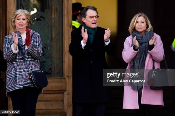 Former Education Minister Irene Rigau, former Catalan President Artur Mas and former Vice-president Joana Ortega applaud to the crowd as they arrive...