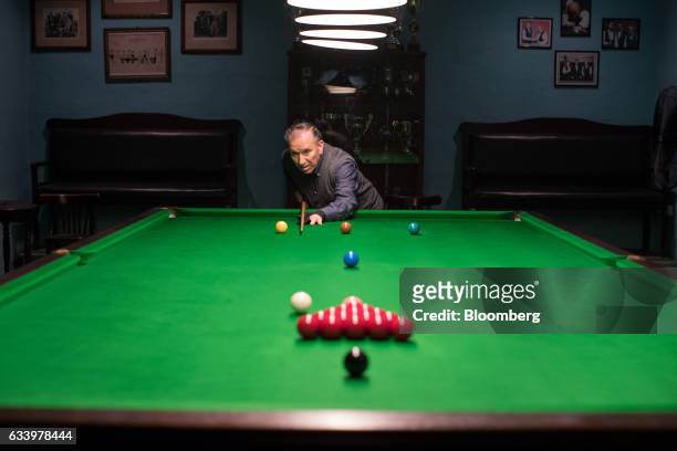 John Cauchi, owner of the Anglo Maltese League Club, plays a game of snooker in Valletta, Malta, on Friday, Feb. 2, 2017. It may be smaller than the...