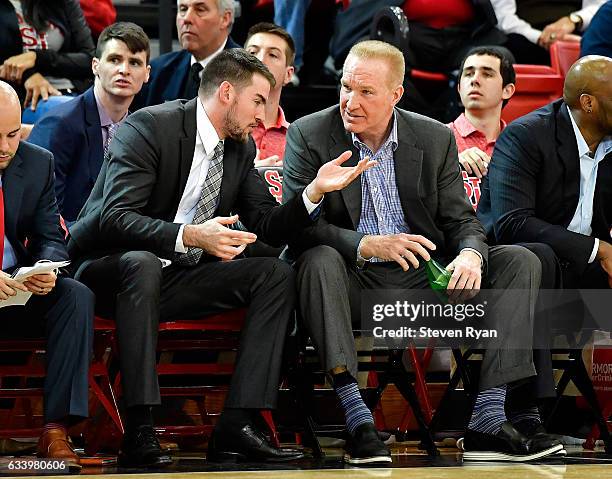 Assistant coach Greg St. Jean talks with head coach Chris Mullin of the St. John's Red Storm against the Delaware State Hornets during the second...