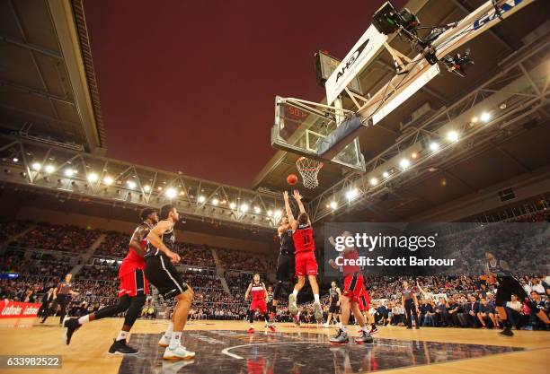 General view with the roof open as David Andersen of United drives to the basket during the round 18 NBL match between Melbourne United and the...