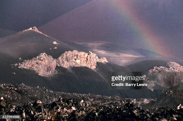 Rainbow formed after an equatorial shower over the empty lava fields, 27th May 1997, on Ascension, a small isolated volcanic island in the equatorial...