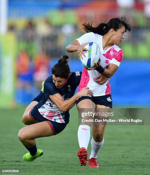 Yume Okuroda of Japan is tackled by Alice Richardson of Great Britain during the Women's Rugby Sevens Pool C match between Great Britain and Japan on...