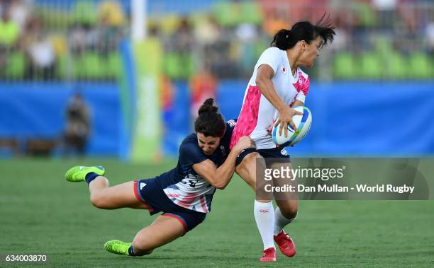 Yume Okuroda of Japan is tackled by Alice Richardson of Great Britain during the Women's Rugby Sevens Pool C match between Great Britain and Japan on...