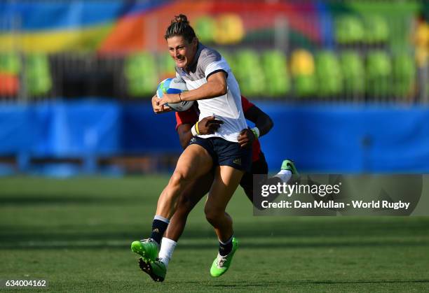 Caroline Ladagnous of France holds off Janet Okelo of Kenya during the Women's Rugby Sevens Pool B match between France and Kenya on Day 1 of the...