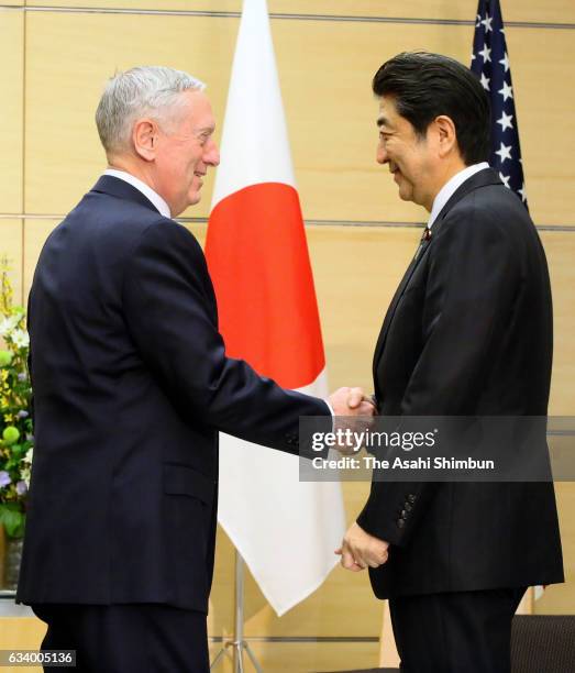 Secretary of Defense James Mattis shakes hands with Japanese Prime Minister Shinzo Abe prior to their meeting at Abe's official residence on February...