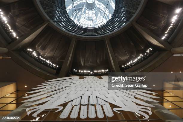 The Federal Eagle hangs under the cupola inside the plenary hall of the Bundestag during preparations for the upcoming session of the Federal...