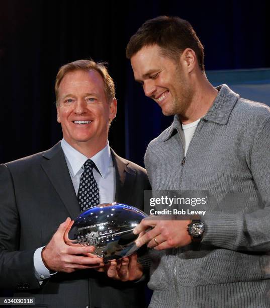 Commissioner Roger Goodell, left, and New England Patriots' Tom Brady with the Pete Rozelle MVP Trophy during the Super Bowl Winner and MVP press...