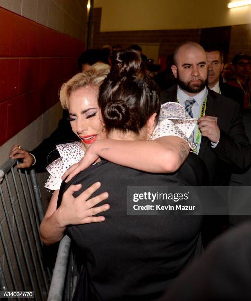 Musician Lady Gaga hugs her sister Natali Germanotta backstage after the Pepsi Zero Sugar Super Bowl LI Halftime Show at NRG Stadium on February 5,...