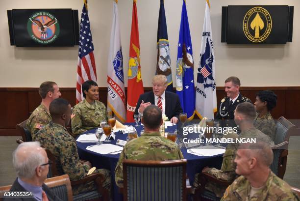 President Donald Trump sits down for lunch with troops during a visit to the US Central Command at MacDill Air Force Base on February 6, 2017 in...