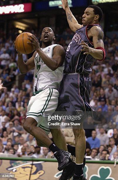 Kenny Anderson of the Boston Celtics drives to the basket while defended by Kenyon Martin of the New Jersey Nets in Game 6 of the Eastern Conference...