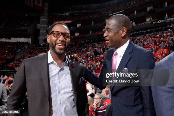 Legends, Tracy McGrady and Dikembe Mutumbo speak during the Yao Ming jersey retirement ceremony during the Chicago Bulls game against the Houston...
