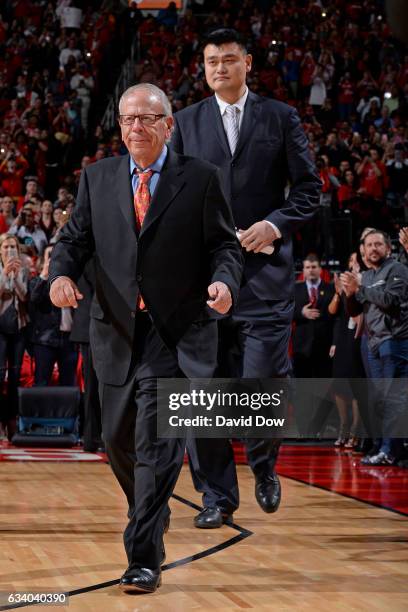 Houston Rockets owner, Leslie Alexander and NBA Legend, Yao Ming walk on the court for his jersey retirement ceremony during the Chicago Bulls game...