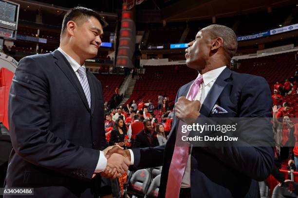 Legends, Yao Ming and Dikembe Mutumbo speak during his jersey retirement ceremony during the Chicago Bulls game against the Houston Rockets on...