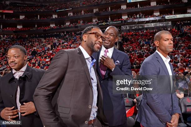 Former NBA players, Steve Francis, Tracy McGrady, Dikembe Mutumbo and Shane Battier attend the Chicago Bulls against the Houston Rockets on February...