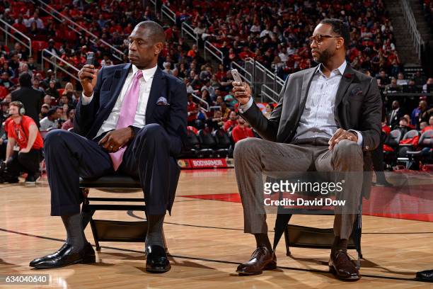 Legends, Dikembe Mutumbo and Tracy McGrady look on during the Yao Ming jersey retirement ceremony during the Chicago Bulls game against the Houston...