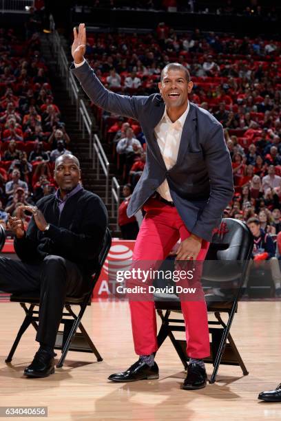 Former NBA player, Shane Battier waves to the crowd during the Yao Ming jersey retirement ceremony during the Chicago Bulls game against the Houston...