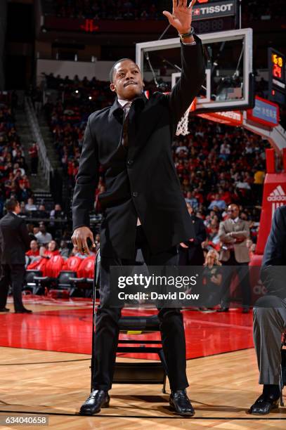 Former NBA player, Steve Francis waves to the crowd during the Yao Ming jersey retirement ceremony during the Chicago Bulls game against the Houston...