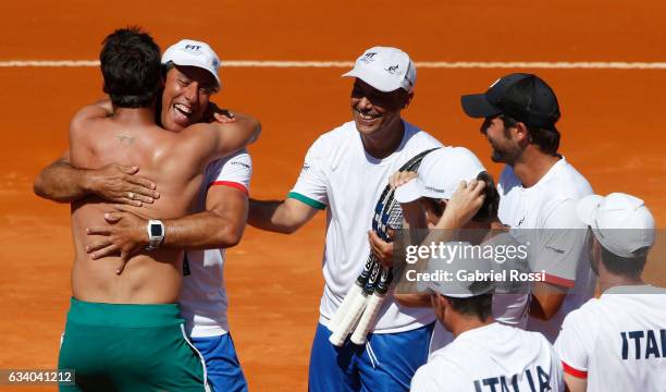 Fabio Fognini of Italy celebrates with teammates after winning a singles match as part of day 3 of the Davis Cup 1st round match between Argentina...