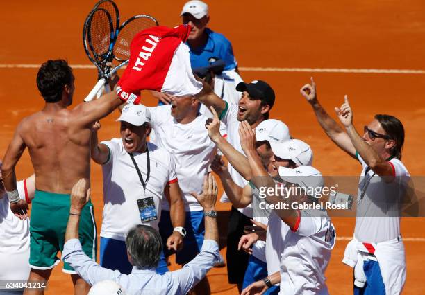 Fabio Fognini of Italy celebrates with teammates after winning a singles match as part of day 3 of the Davis Cup 1st round match between Argentina...