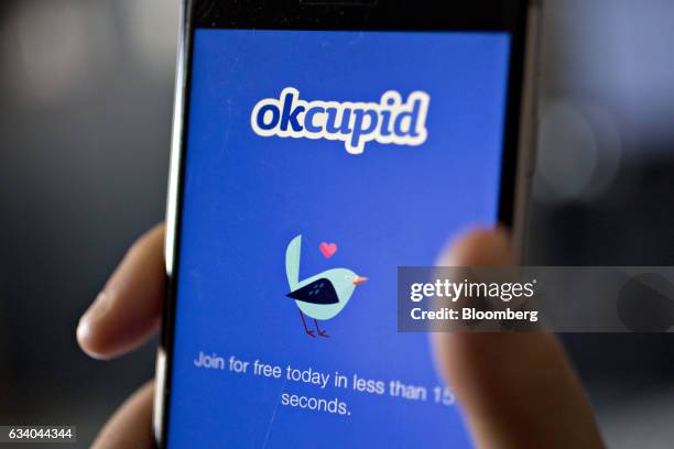 The OkCupid application is demonstrated for a photograph on an Apple Inc. IPhone in Washington, D.C., U.S., on Saturday, Feb. 4, 2017....