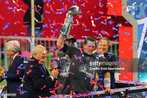 New England Patriots Quarterback Tom Brady raises the Vince Lombardi Trophy to celebrate the victory during the New England Patriots 34-28 victory...