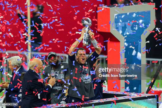 New England Patriots Quarterback Tom Brady raises the Vince Lombardi Trophy to celebrate the victory during the New England Patriots 34-28 victory...