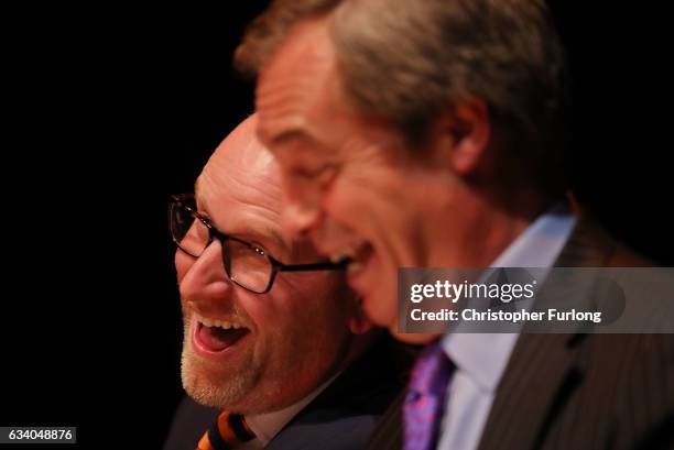 Leader Paul Nuttall and former Leader Nigel Farage MEP speak during a public meeting on February 6, 2017 in Stoke, England. The Stoke-on-Trent...