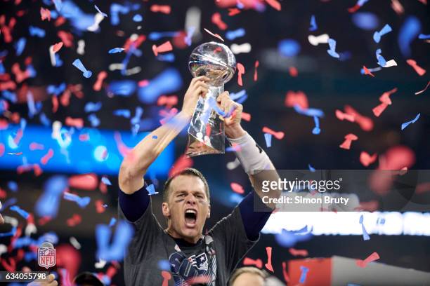 Super Bowl LI: New England Patriots QB Tom Brady victorious, holding up Vince Lombardi Trophy after winning game vs Atlanta Falcons at NRG Stadium....