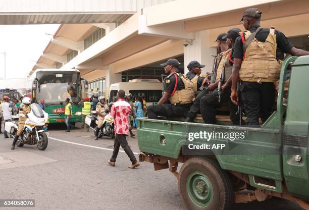 Police escort is in place as the Cameroon national football team leaves the international airport for the capital Yaounde on February 6 a day after...