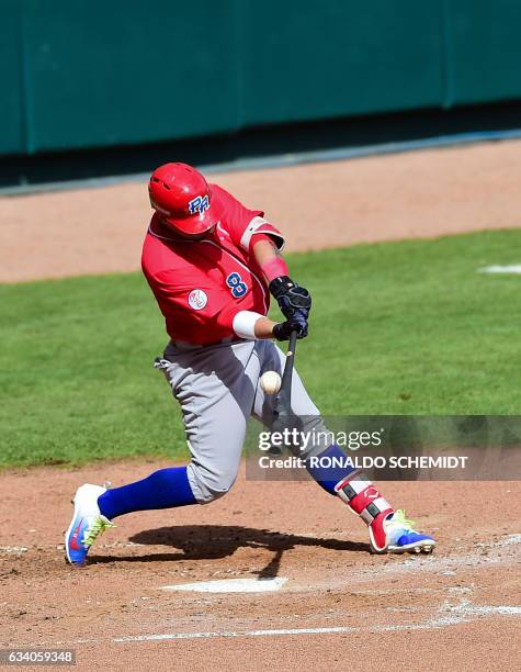 Jorge Padilla of Criollos de Caguas of Puerto Rico bats during a Caribbean Baseball Series match against Aguilas del Zulia of Venezuela at the...