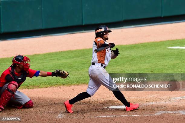 Freddy Galvis of Aguilas del Zulia of Venezuela bats during a Caribbean Baseball Series match against Criollos de Caguas from Puerto Rico at the...