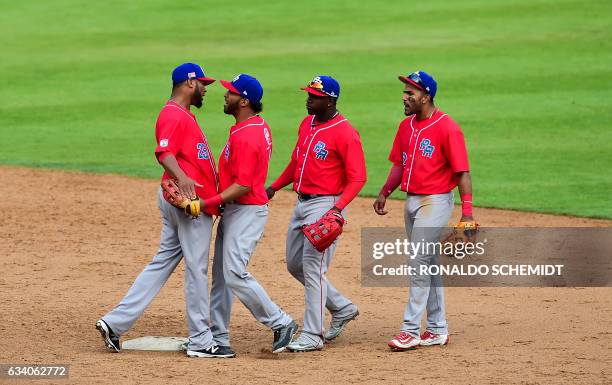 Pitcher Ricardo Gomez of Criollos de Caguas of Puerto Rico celebrates with teammates after they won the Caribbean Baseball Series semifinal match...