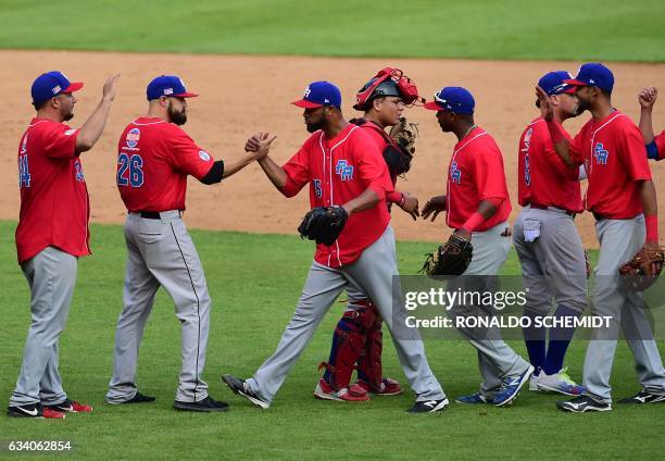 Pitcher Ricardo Gomez of Criollos de Caguas of Puerto Rico celebrates with teammates after they won the Caribbean Baseball Series semifinal match...