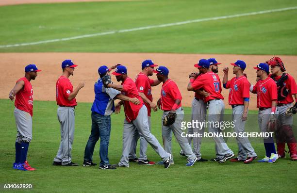 Players of Criollos de Caguas of Puerto Rico celebrate after winnning the Caribbean Baseball Series semifinal match against Aguilas del Zulia of...