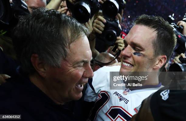 Tom Brady and head coach Bill Belichick of the New England Patriots celebrate a 34-28 overtime win against the Atlanta Falcons during Super Bowl 51...