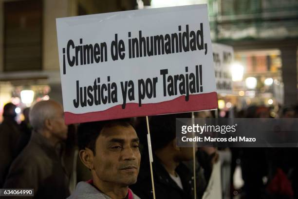 Man with a placard that reads "Crime of inhumanity, justice for Taraja!" protesting in front of the Ministry of Foreign Affairs, during the...
