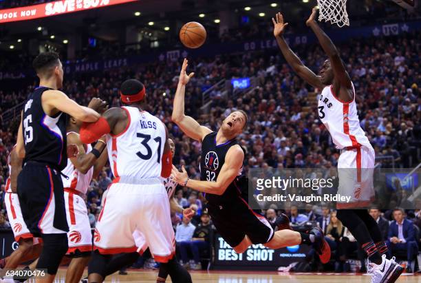 Blake Griffin of the Los Angeles Clippers throws up a shot as Pascal Siakam of the Toronto Raptors defends during the first half of an NBA game at...